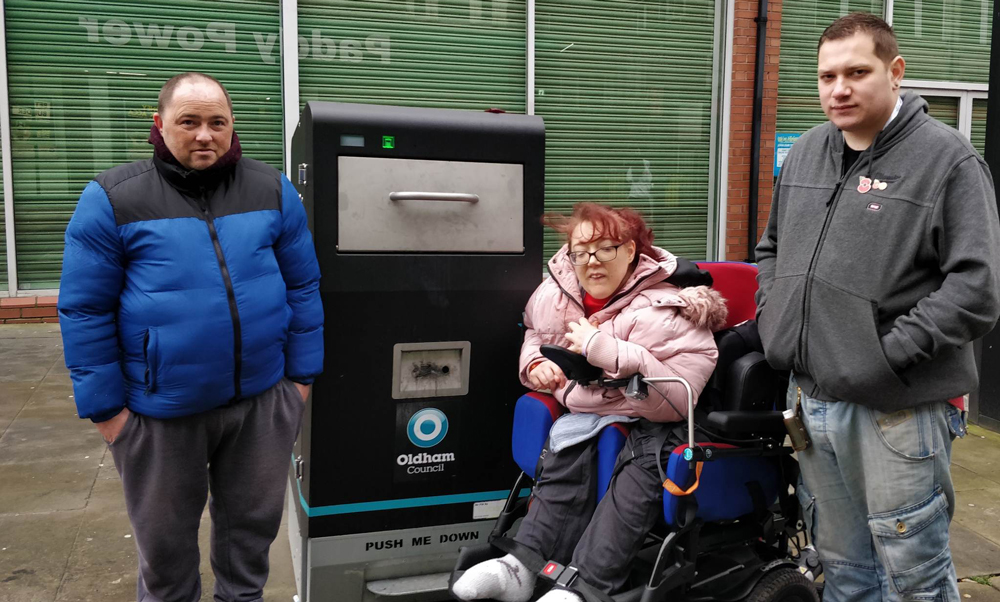 Lewis and Shona Farnworth with Councillor Lewis Hamblett at one of the bins